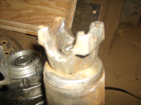 1986 Ford Bronco - This photo shows a close-up of a vehicle's driveshaft universal joint, likely in a workshop setting.