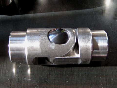 1996 Ford Bronco - A metal universal joint part is shown in detail, likely for automotive or industrial use.