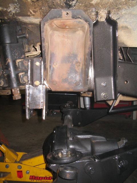 1979 Ford Bronco - Custom suspension components are shown, possibly for a 1-ton swap, with a yellow jack visible.