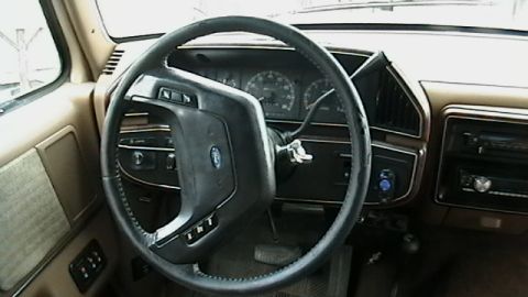 1990 Ford Bronco - Interior view of a 1990 Ford Bronco, the dashboard and steering wheel.