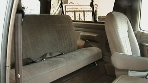 1990 Ford Bronco - Interior view of a 1990 Ford Bronco, highlighting the front passenger and rear bench seats.
