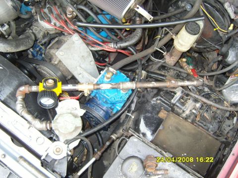 1989 Ford Bronco - Aftermarket compressor and gauges installed in an engine bay, with visible date stamp 24/04/2008.