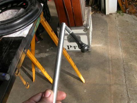 1990 Ford Bronco - Simple looking tool, and it's pretty much impossible to install a valve stem without it.