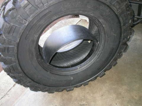 1990 Ford Bronco - And there it is inside the tire. The insert is not completely rigid like a PVC insert, so it will get a little egg shaped while you're inse…