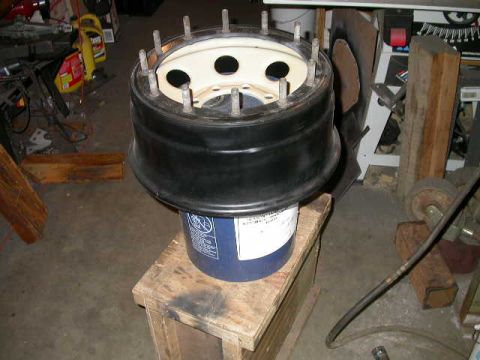 1990 Ford Bronco - Time to mount them up. First, put the back half of the wheel on a bucket.