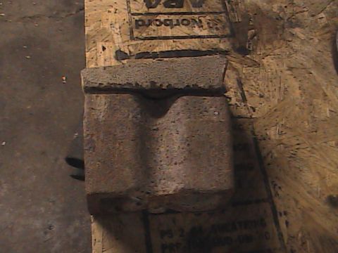 1980 Dodge Magnum - Concrete block with a curved indentation sits on a piece of plywood. Supermotors.net logo is in the corner.