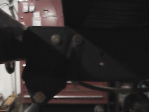 1980 Dodge Magnum - Close-up of a black metal bracket with visible bolts, likely a suspension component.