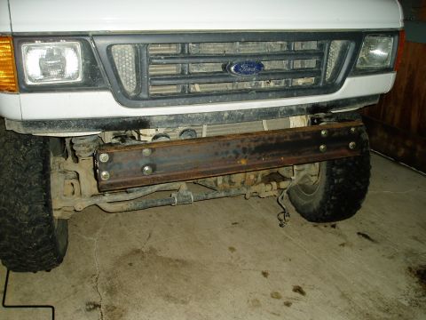 2000 Ford E350 - The front of a Ford E-Series van shows a custom-fabricated bumper made from steel beams.