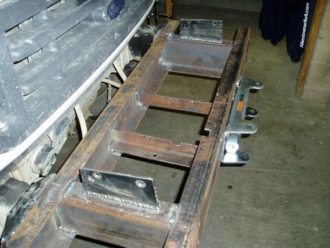 2000 Ford E350 - Custom bumper fabrication in progress on a 2000 Ford truck, with a focus on the welded steel structure and attachment points.