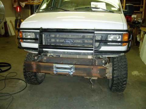 2000 Ford E350 - This Ford van has a custom bumper with a winch, and a grille guard.