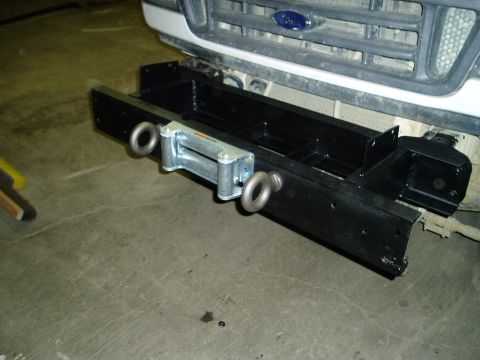 2000 Ford E350 - Custom winch bumper with tow hooks installed on the front of a 2000 Ford E350.