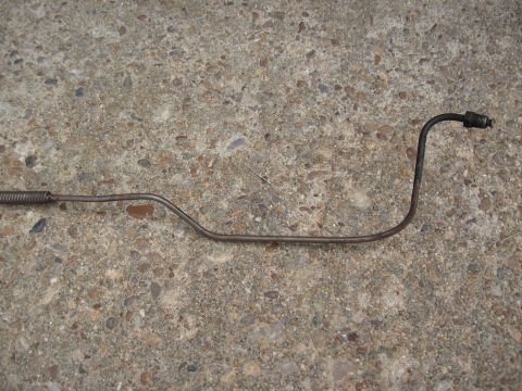 1968 Shelby GT500 - A single metal brake line is shown against a concrete background.