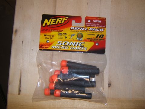 1988 Ford Bronco - A refill pack of Nerf Sonic Micro Darts is shown, containing ten darts with orange tips.