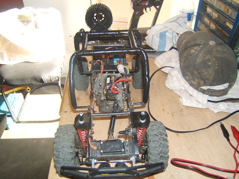 1988 Ford Bronco - This RC crawler chassis is disassembled, showing its internal mechanics and suspension system.