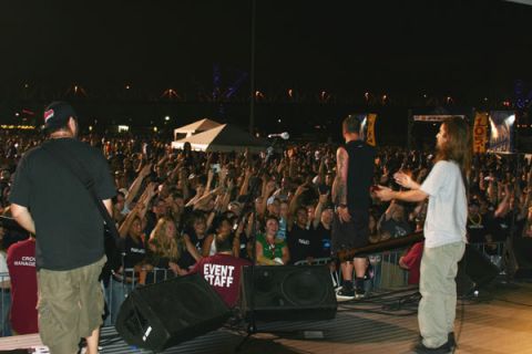 1987 Ford Bronco - A large crowd enjoys a nighttime concert performance, with a bridge visible in the distance.
