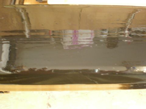 1993 Ford Bronco - A reflection shows stacked items on a dark, glossy surface, with a Supermotors watermark visible at the bottom right.