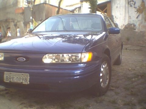 1995 Ford Taurus - Front quarter view of a blue 1995 Ford Taurus sedan parked outdoors.