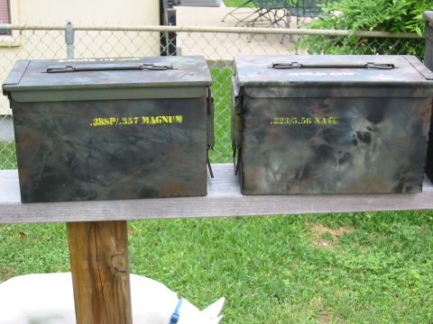 1996 Ford Bronco - Two camouflage ammo cans are displayed outdoors on a wooden surface with grass in the background.
