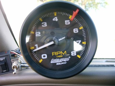 2000 Mercury Grand Marquis - Close-up of an Auto Gage tachometer, showing RPM readings.
