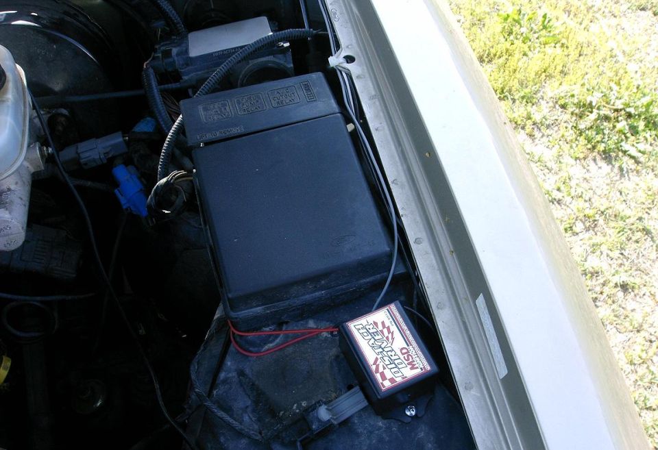 Engine bay with black fuse box and MSD Digital 6AL ignition control module