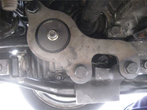 1993 Ford Probe - Close-up view of an engine mount bracket, likely from the underside of a vehicle.