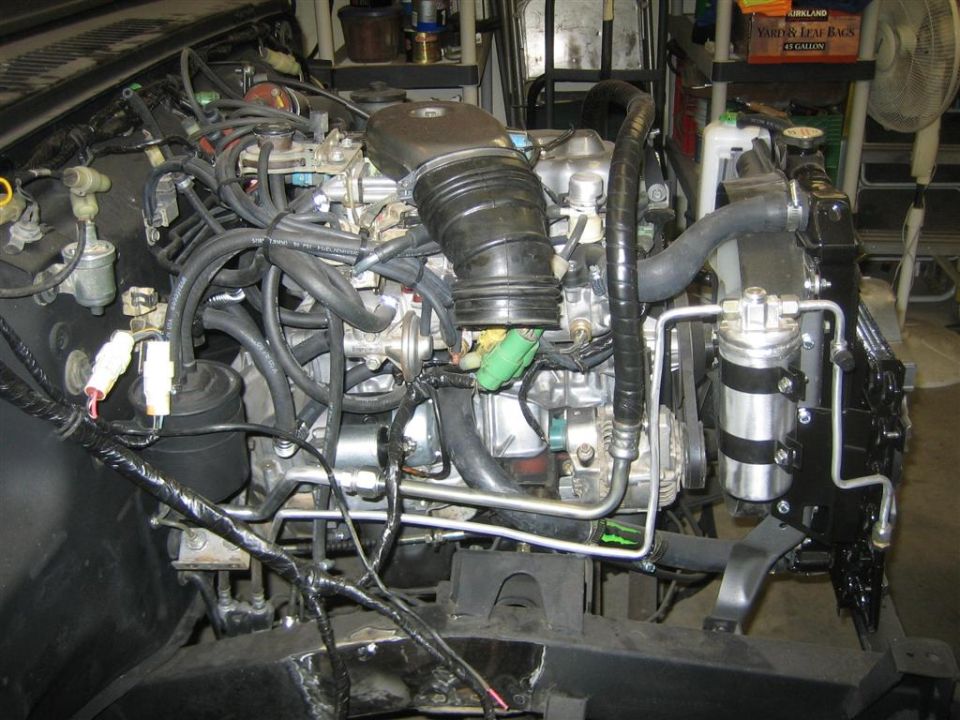 Engine bay with hoses and wiring