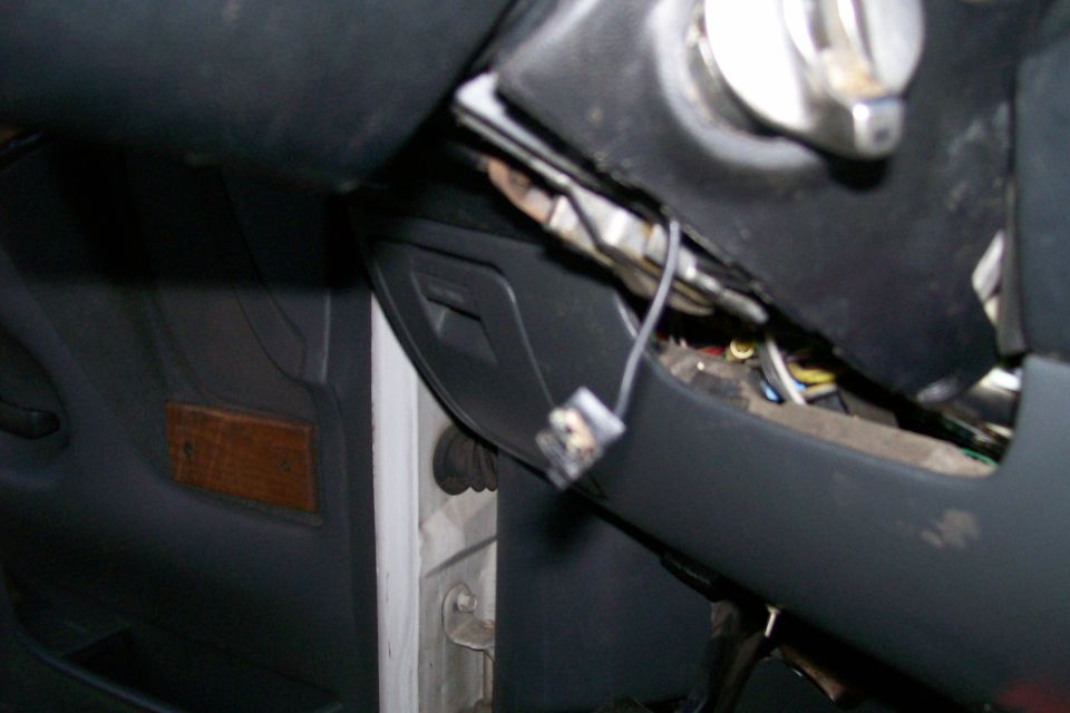 Anyone recognize where the plug belongs?  I know it's a bad pic, but it is curved, like it rest up against something cyliderical, maybe the key cylinder?  I don't know, but if you know, please leave a comment!