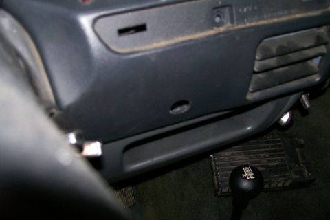 1992 Ford C-350 (Centurion Conversions) - Close-up of a vehicle's interior, focusing on the gear shift knob and surrounding dashboard elements.