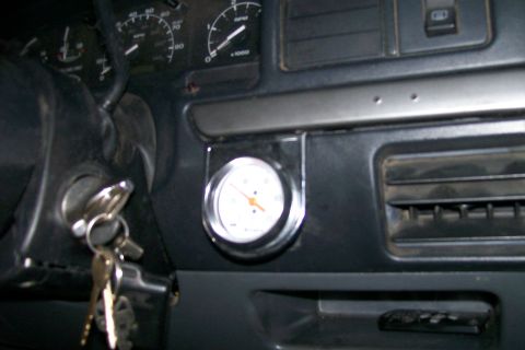 1992 Ford C-350 (Centurion Conversions) - Interior view of a vehicle dashboard, showing gauges and keys in the ignition.