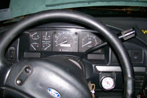 1992 Ford C-350 (Centurion Conversions) - Interior view of a 1992 Ford C-350 Centurion Conversions, showing the dashboard gauges and steering wheel.