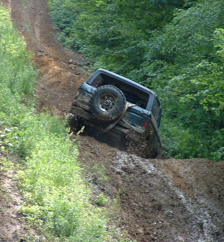 1988 Ford Bronco - This 1988 Ford Bronco navigates a steep, muddy off-road trail.