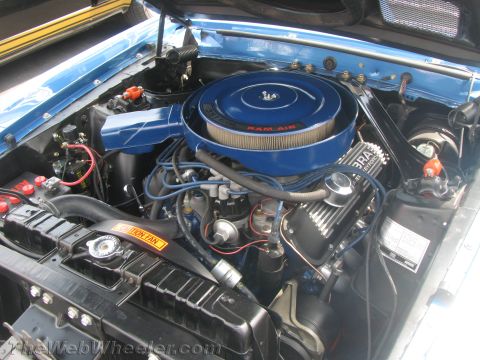 1968 Ford Mustang - The engine bay of a blue 1968 Ford Mustang features a 390 V8 with Ram Air induction.