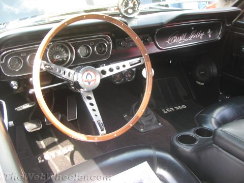 1968 Ford Mustang - Interior view of a 1966 Shelby GT350, a wood-rimmed steering wheel and GT350 badging.