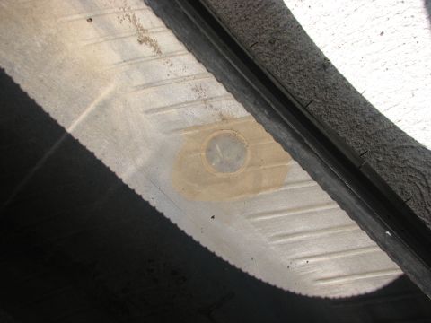 2003 Ford Crown Victoria - Tire patch visible inside the tire tread area.