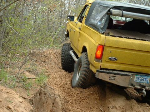 1988 Ford Bronco - This 1988 Ford Bronco is navigating a steep dirt incline during an off-road excursion.