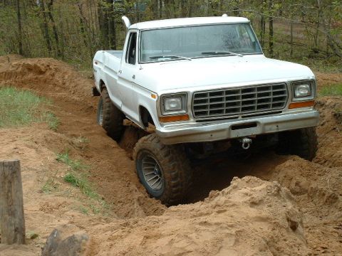 1988 Ford Bronco - This lifted 1979 Ford F-150 is shown tackling a challenging sandy terrain during an off-road excursion.