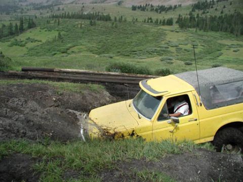1988 Ford Bronco - This 1988 Ford Bronco is stuck deep in a muddy off-road trail.