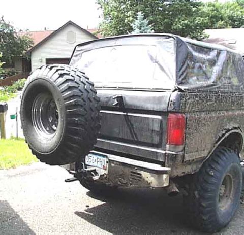 1988 Ford Bronco - This 1988 Ford Bronco has a soft top and a spare tire mounted on the rear. The vehicle appears to have been driven off-road.