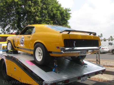 1968 Ford Mustang - This yellow 1969 Ford Mustang Boss 302, identifiable by its racing stripes and prominent number 15, is seen being transported on a tow truc…