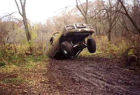 1988 Ford Bronco - This 1988 Ford Bronco appears to be stuck in the mud during an off-road excursion.
