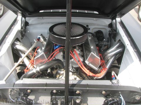 1968 Ford Mustang - Custom V8 engine with performance parts, viewed from above.