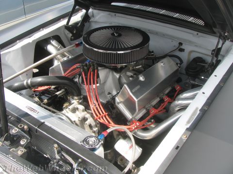 1968 Ford Mustang - Close-up view of a modified V8 engine, highlighting its performance components and custom build.