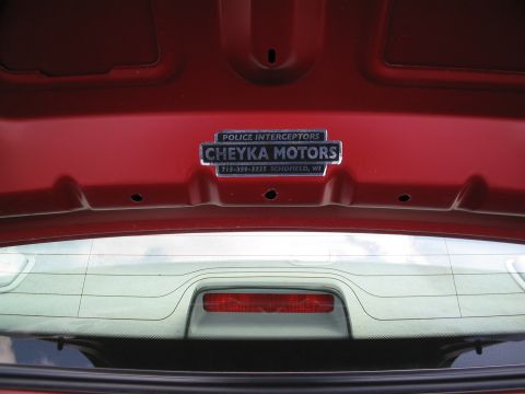 2001 Ford Crown Victoria - A badge on the trunk lid indicates it was previously a police interceptor and serviced by Cheyka Motors.