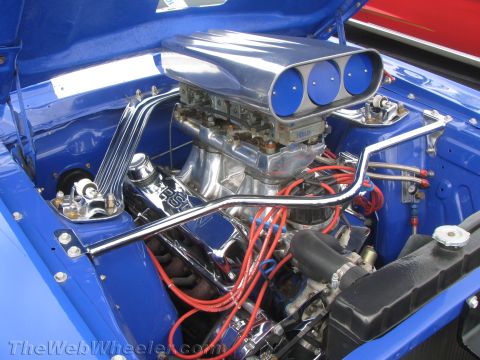 1968 Ford Mustang - Customized engine bay a prominent chrome air intake and polished components.