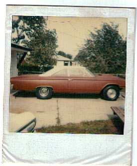 1963 Ford Galaxie - Side view of a red 1963 Ford Galaxie hardtop with a white vinyl roof.