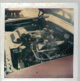 1963 Ford Galaxie - Close-up view of a car's engine compartment, a V8 engine with dual carburetors and air filters.