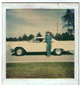 1963 Ford Galaxie - A man poses with his white car on a sunny day. The car appears to be a convertible from the early 1960s.