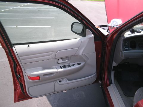 2001 Ford Crown Victoria - Interior view of a 2001 Ford Crown Victoria, showing the driver's side door panel and dashboard details.