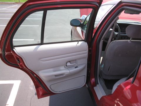 2001 Ford Crown Victoria - Interior view of a 2001 Ford Crown Victoria, focusing on the passenger side door and seat.