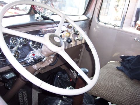 1981 Kenworth W900A - Interior view of a truck cab, showing the steering wheel, dashboard, and various controls.